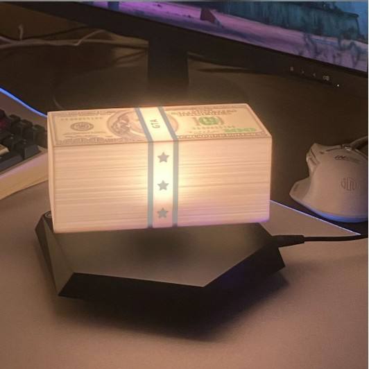 Money Lamp na czarnej fasetowanej podstawie
